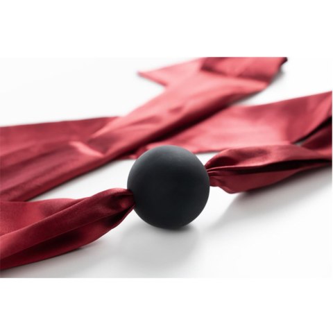 Silicone ball gag with satin straps.